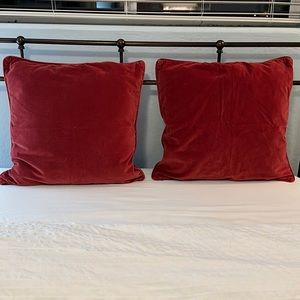 2 Lg. Dark red velvet pillows with zip off covers.